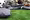 Green area with a bunch of sitting pillows and people chilling