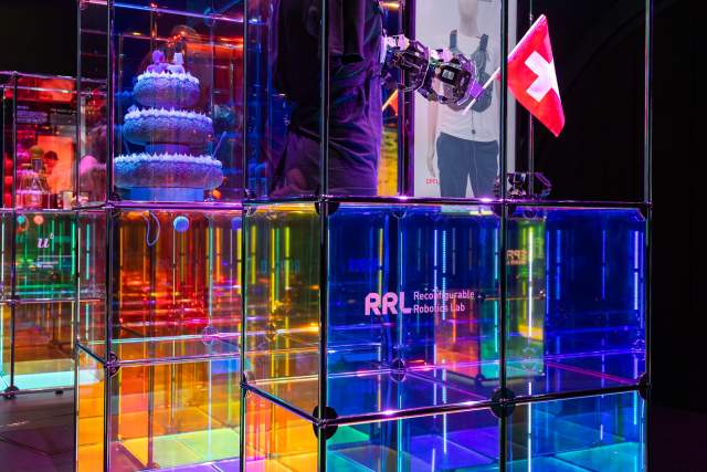 Colorful illuminated exhibition display inside the Swiss Pavilion at Expo 2025 Osaka.