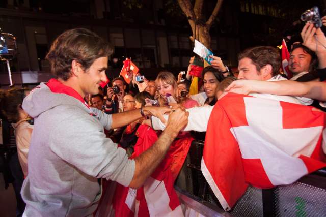 Roger Federer signing autographs for his supporters