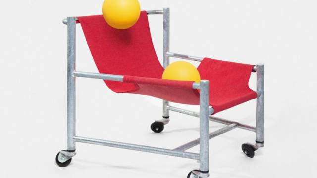 Red long chair with yellow balls