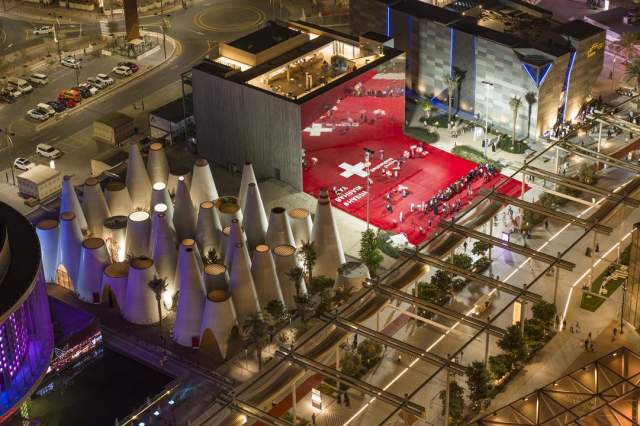 Aerial view of the Swiss Pavilion, highlighting its distinctive architecture and vibrant event space.
