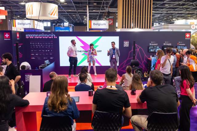 Audience watching a presentation on the swisstech stage at VivaTech 2026 in Paris.